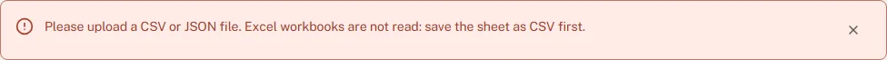 The red message bar under the page title with the text "Please upload a CSV or JSON file. Excel workbooks are not read …" and a close button
